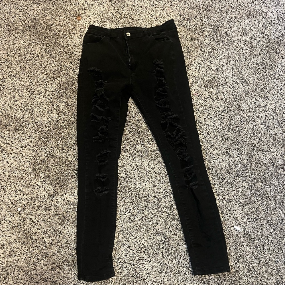 Black jeans with rips down the front.
